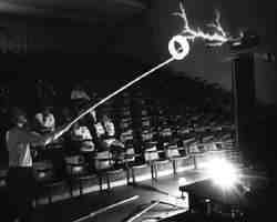 Vincent P. Mallette / Rehearsal for CNN Feature of Technology Demos -- He is holding a Circline fluorescent tube on an 8-ft pole up to a large Tesla coil